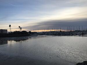 boats docked at the emeryville marina at sunset