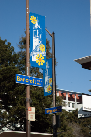 yellow and blue street banner of the campanile at the intersection of telegraph and bancroft 